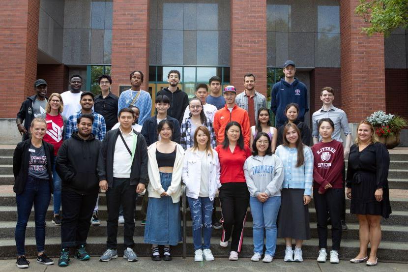 Group of new international students on library steps